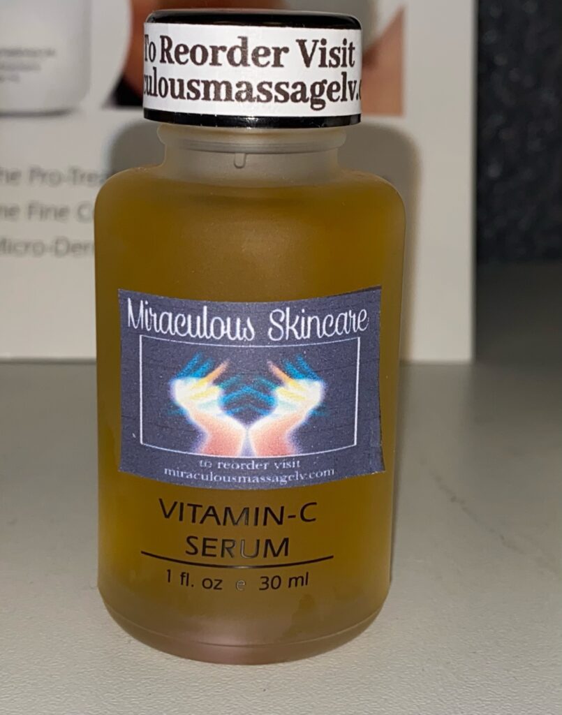 A bottle of vitamin c serum sitting on top of a counter.